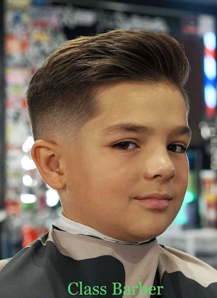 Child receiving a haircut at Class Barber