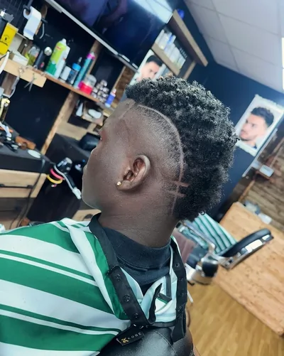 Client with a finished haircut and fade inside the shop