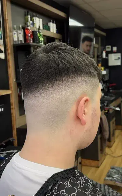 Side view of a precise skin fade by Class Barber